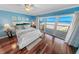 Main bedroom with ocean view, hardwood floors, and walk-in closet at 4773 S Atlantic Ave # 10, Ponce Inlet, FL 32127