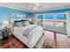 Main bedroom with ocean view, hardwood floors, and walk-in closet at 4773 S Atlantic Ave # 10, Ponce Inlet, FL 32127