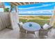 Ocean view from private patio with wicker table and chairs at 4773 S Atlantic Ave # 10, Ponce Inlet, FL 32127