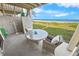 Oceanfront patio with table and chairs for relaxing at 4773 S Atlantic Ave # 10, Ponce Inlet, FL 32127