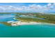 Aerial view of coastline, inlet, and lighthouse at 50 Pompano Dr, Ponce Inlet, FL 32127