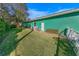 Large backyard with grassy area and privacy fence at 50 Pompano Dr, Ponce Inlet, FL 32127