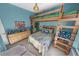 Bedroom with a bunk bed and wicker furniture at 50 Pompano Dr, Ponce Inlet, FL 32127