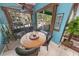 Bright breakfast nook with a round table and view of the pool at 50 Pompano Dr, Ponce Inlet, FL 32127