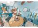 Bright dining area with a round table and four chairs, situated near kitchen at 50 Pompano Dr, Ponce Inlet, FL 32127