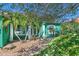 Welcoming front entry with lush landscaping and brick walkway at 50 Pompano Dr, Ponce Inlet, FL 32127