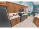 Bright kitchen with custom cabinetry and breakfast bar at 50 Pompano Dr, Ponce Inlet, FL 32127