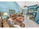 Bright living room with high ceilings and tiled floors at 50 Pompano Dr, Ponce Inlet, FL 32127