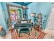 Dedicated music room with piano and southwestern decor at 50 Pompano Dr, Ponce Inlet, FL 32127