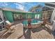 Relaxing pool area with covered patio and lounge chairs at 50 Pompano Dr, Ponce Inlet, FL 32127