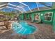 Inviting kidney-shaped pool with a covered patio at 50 Pompano Dr, Ponce Inlet, FL 32127