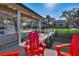 Covered dock with red chairs and boat lift at 504 N Riverside Dr, New Smyrna Beach, FL 32168