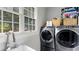 Bright laundry room with washer, dryer and sink at 504 N Riverside Dr, New Smyrna Beach, FL 32168