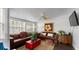 Relaxing living room with leather sofas and a red accent chest at 504 N Riverside Dr, New Smyrna Beach, FL 32168