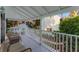 Covered porch with seating area, overlooks backyard at 504 N Riverside Dr, New Smyrna Beach, FL 32168