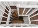 Unique spiral staircase connecting floors of the home at 504 N Riverside Dr, New Smyrna Beach, FL 32168