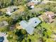 Aerial view showcasing the home's roofline and its placement among surrounding houses at 507 Boxwood Ln, New Smyrna Beach, FL 32168