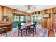 Charming dining room with wood walls and a view to the backyard at 507 Boxwood Ln, New Smyrna Beach, FL 32168