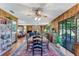 Spacious dining room features a wood table and chairs, oriental rug, and view into living room at 507 Boxwood Ln, New Smyrna Beach, FL 32168