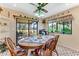 Kitchen breakfast nook with round table and view of golf course at 507 Boxwood Ln, New Smyrna Beach, FL 32168