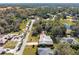 Aerial view of a house with a grey roof in a residential neighborhood at 51 Club House Blvd, New Smyrna Beach, FL 32168