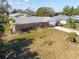 An aerial view of a home with a brick exterior and a landscaped yard at 51 Club House Blvd, New Smyrna Beach, FL 32168