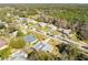 An aerial view of a house with a grey roof in a neighborhood setting at 51 Club House Blvd, New Smyrna Beach, FL 32168