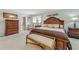 Bright bedroom featuring a king-size bed and ensuite bathroom access at 51 Club House Blvd, New Smyrna Beach, FL 32168