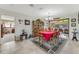 Bright dining room features a wood table, red tablecloth, and built-in hutch at 51 Club House Blvd, New Smyrna Beach, FL 32168