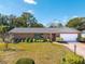 House exterior, brick facade, and landscaped lawn at 51 Club House Blvd, New Smyrna Beach, FL 32168