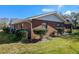 Brick home exterior with manicured landscaping at 51 Club House Blvd, New Smyrna Beach, FL 32168