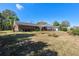 Brick home exterior with attached garage and front yard at 51 Club House Blvd, New Smyrna Beach, FL 32168