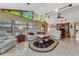 Sunlit Gathering room with vaulted ceiling, stained glass windows, and ample seating at 51 Club House Blvd, New Smyrna Beach, FL 32168