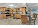 Updated kitchen, featuring stainless steel appliances and light wood cabinets at 51 Club House Blvd, New Smyrna Beach, FL 32168