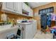 Bright laundry room with white cabinets and ample storage at 51 Club House Blvd, New Smyrna Beach, FL 32168