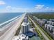 Aerial view of beachfront property and coastline at 5207 S Atlantic Ave # 626, New Smyrna Beach, FL 32169