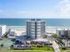 Aerial perspective showcasing beachfront building and surroundings at 5207 S Atlantic Ave # 626, New Smyrna Beach, FL 32169