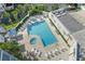 Inviting pool area with plenty of lounge chairs and a hot tub at 5207 S Atlantic Ave # 626, New Smyrna Beach, FL 32169