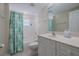 Guest bathroom with tub shower combo at 5300 S Atlantic Ave # 15-201, New Smyrna Beach, FL 32169