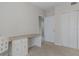 Bedroom with built-in desk and double doors at 5300 S Atlantic Ave # 15-201, New Smyrna Beach, FL 32169