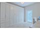 Bedroom with built-in wall bed and ample storage at 5300 S Atlantic Ave # 15-201, New Smyrna Beach, FL 32169