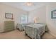 Guest bedroom with twin beds and dresser at 5300 S Atlantic Ave # 15-201, New Smyrna Beach, FL 32169