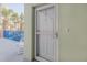 Condo's front door with security screen at 5300 S Atlantic Ave # 15-201, New Smyrna Beach, FL 32169