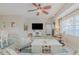 Living room with a large TV and comfy seating at 5300 S Atlantic Ave # 15-201, New Smyrna Beach, FL 32169