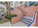 Exterior condo stairwell with blue railings at 5300 S Atlantic Ave # 15-201, New Smyrna Beach, FL 32169