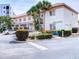 Exterior view of the Rec Bldg II building, with well-maintained landscaping and ample parking spaces at 5300 S Atlantic Ave # 3-504, New Smyrna Beach, FL 32169