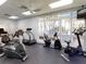 Community fitness center featuring a variety of exercise equipment and large windows at 5300 S Atlantic Ave # 3-504, New Smyrna Beach, FL 32169