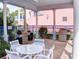 Outdoor grilling area with stainless steel grills, seating, and shaded pergola at 5300 S Atlantic Ave # 3-504, New Smyrna Beach, FL 32169