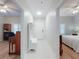 Central hallway with white doors leading to the bedrooms, offering a seamless flow and natural light at 5300 S Atlantic Ave # 3-504, New Smyrna Beach, FL 32169