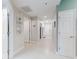 Bright hallway featuring white doors, modern lighting, and stylish decor at 5300 S Atlantic Ave # 3-504, New Smyrna Beach, FL 32169
